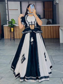 Black and white lehenga choli with mirror work for Navratri Garba nights