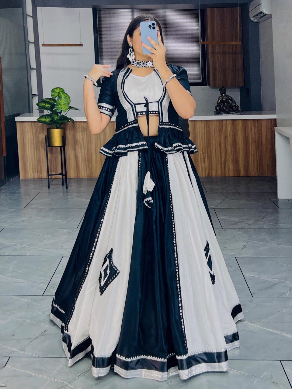 Black and white lehenga choli with mirror work for Navratri Garba nights