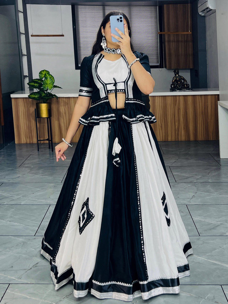Black and white lehenga choli with mirror work for Navratri Garba nights