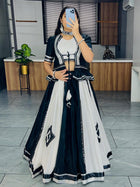 Black and white lehenga choli with mirror work for Navratri Garba nights