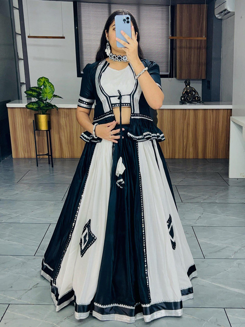 Black and white lehenga choli with mirror work for Navratri Garba nights