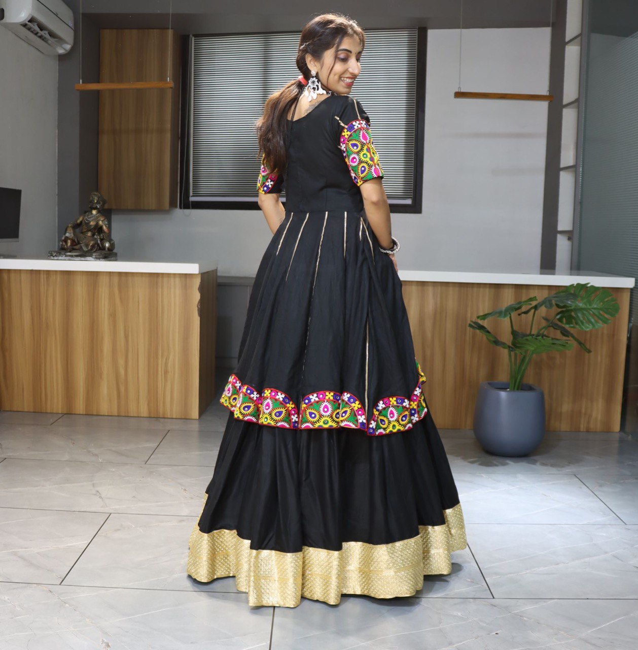 Black lehenga choli with colorful mirror embroidery for Navratri and festive occasions