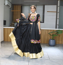 Black lehenga choli with colorful mirror embroidery for Navratri and festive occasions