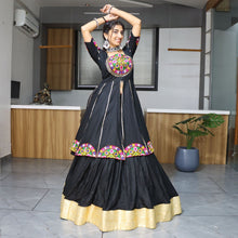 Black lehenga choli with colorful mirror embroidery for Navratri and festive occasions