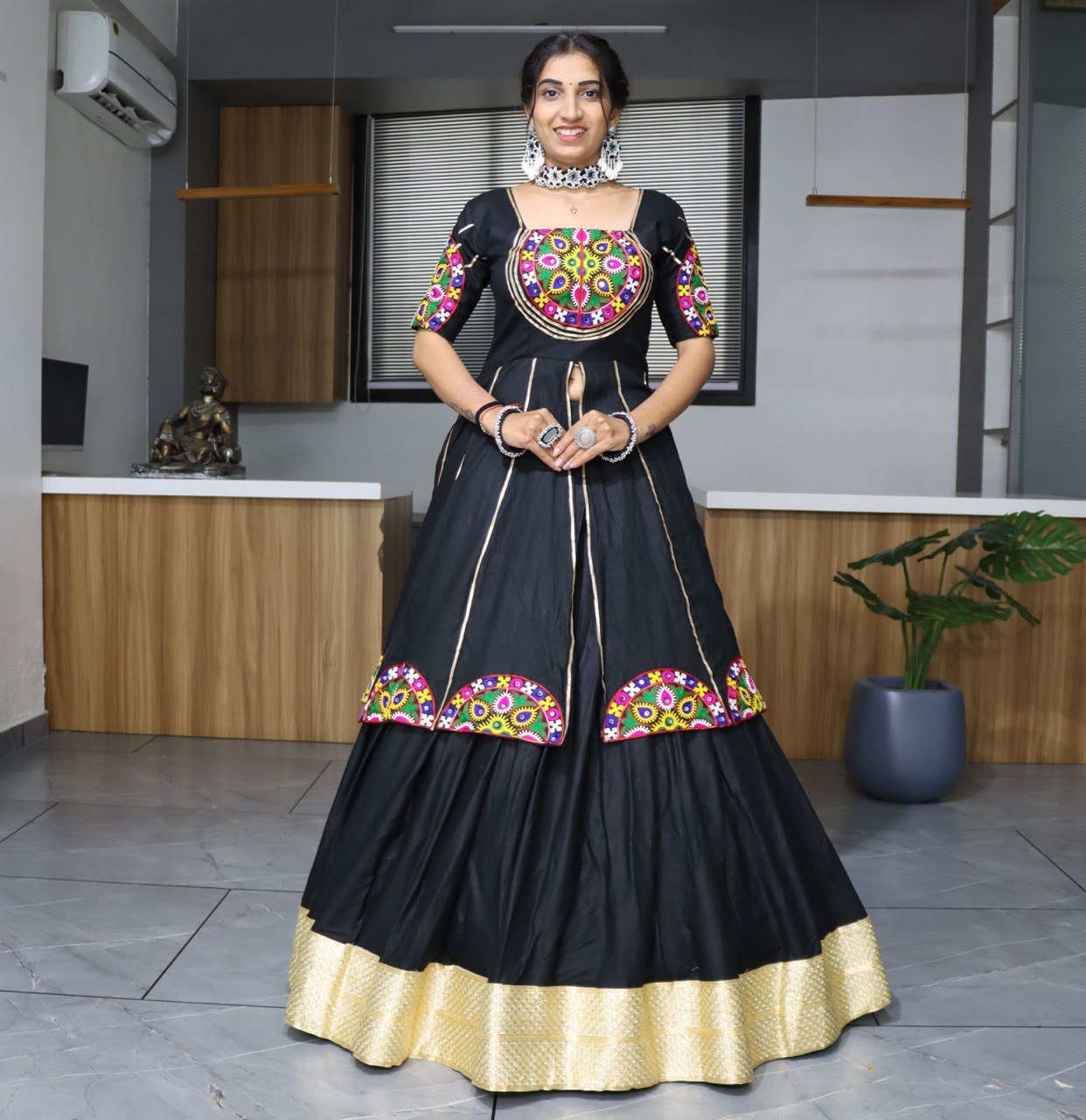 Black lehenga choli with colorful mirror embroidery for Navratri and festive occasions