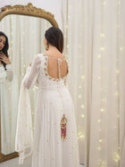 Graceful white anarkali salwar suit with subtle sequin work and dupatta – perfect for festive wear, weddings, or Eid looks.