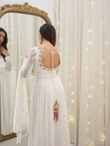 Graceful white anarkali salwar suit with subtle sequin work and dupatta – perfect for festive wear, weddings, or Eid looks.