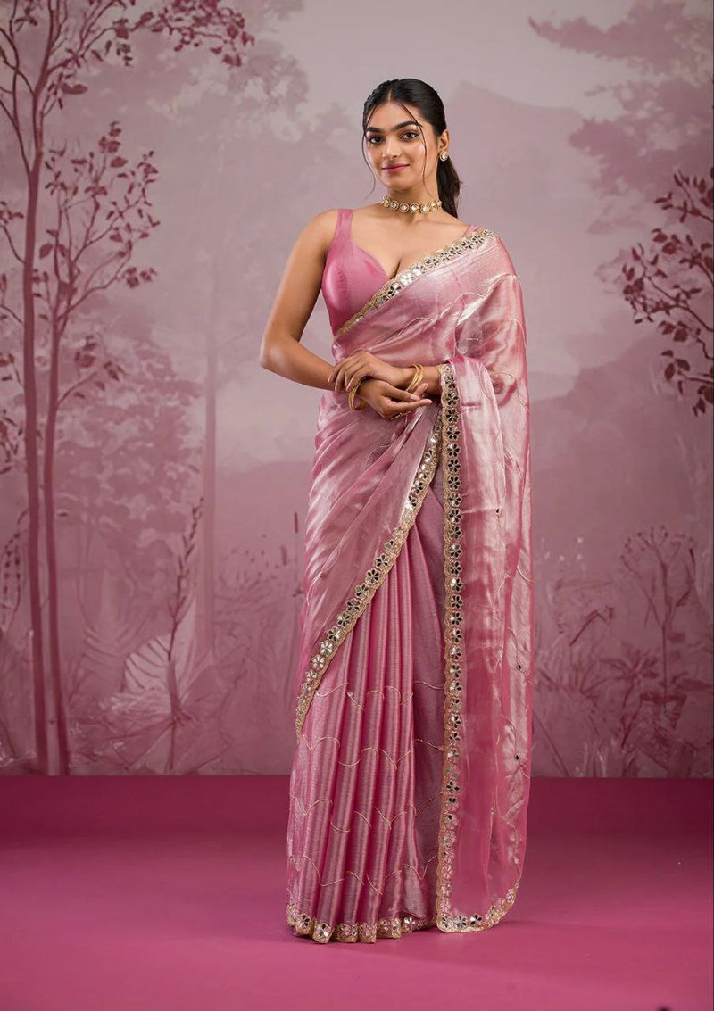 Elegant organza saree with floral embroidered border, perfect for festive events