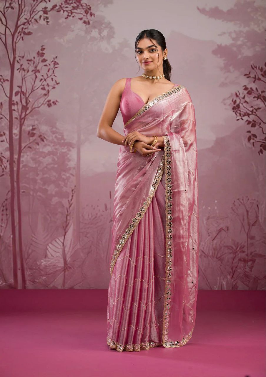 Elegant organza saree with floral embroidered border, perfect for festive events