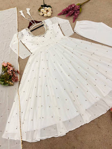 Graceful white anarkali salwar suit with subtle sequin work and dupatta – perfect for festive wear, weddings, or Eid looks.