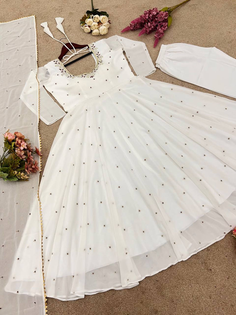 Graceful white anarkali salwar suit with subtle sequin work and dupatta – perfect for festive wear, weddings, or Eid looks.