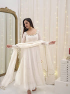 Graceful white anarkali salwar suit with subtle sequin work and dupatta – perfect for festive wear, weddings, or Eid looks.
