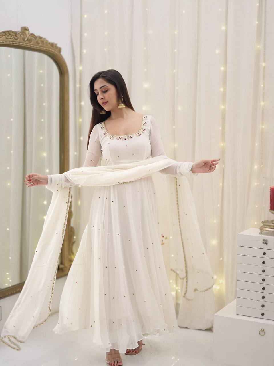 Graceful white anarkali salwar suit with subtle sequin work and dupatta – perfect for festive wear, weddings, or Eid looks.
