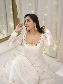 Graceful white anarkali salwar suit with subtle sequin work and dupatta – perfect for festive wear, weddings, or Eid looks.