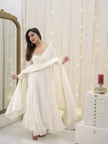 Graceful white anarkali salwar suit with subtle sequin work and dupatta – perfect for festive wear, weddings, or Eid looks.