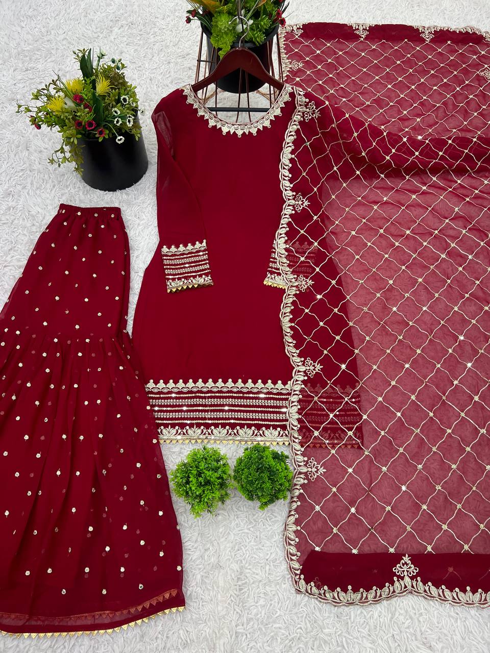 Maroon sharara suit with golden embroidery and net dupatta for weddings and festive occasions
