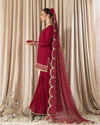 Maroon sharara suit with golden embroidery and net dupatta for weddings and festive occasions