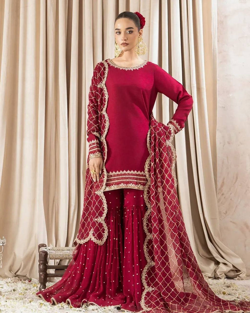 Maroon sharara suit with golden embroidery and net dupatta for weddings and festive occasions