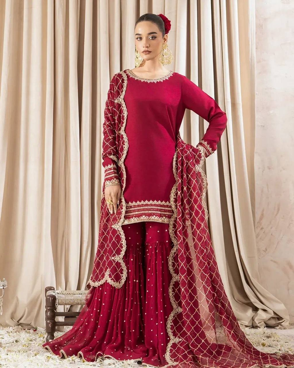 Maroon sharara suit with golden embroidery and net dupatta for weddings and festive occasions