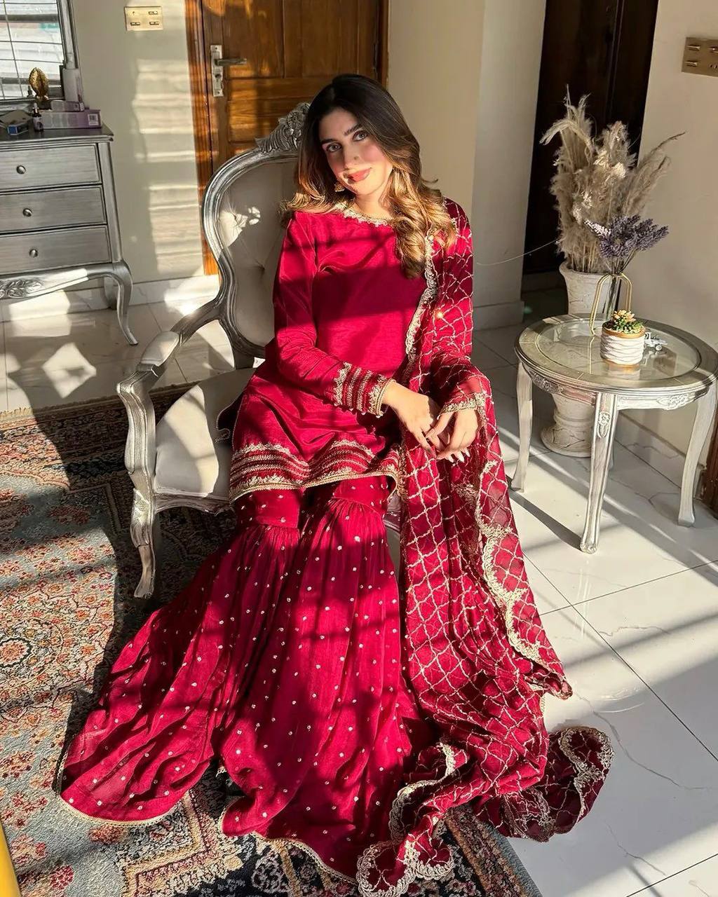 Maroon sharara suit with golden embroidery and net dupatta for weddings and festive occasions