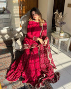 Maroon sharara suit with golden embroidery and net dupatta for weddings and festive occasions