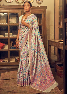 Discover this cream silk saree adorned with multicolor floral print and rich traditional border