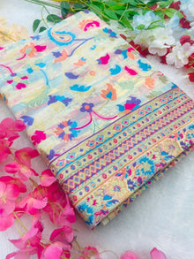 Discover this cream silk saree adorned with multicolor floral print and rich traditional border