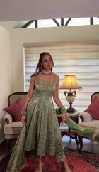 Elegant Light Green Anarkali Suit with Spaghetti Straps and Embroidered Dupatta