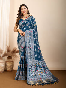 Elegant pure blue silk saree with intricate Mina Kari weaving and a grand rich pallu poojas, and cultural festivities.