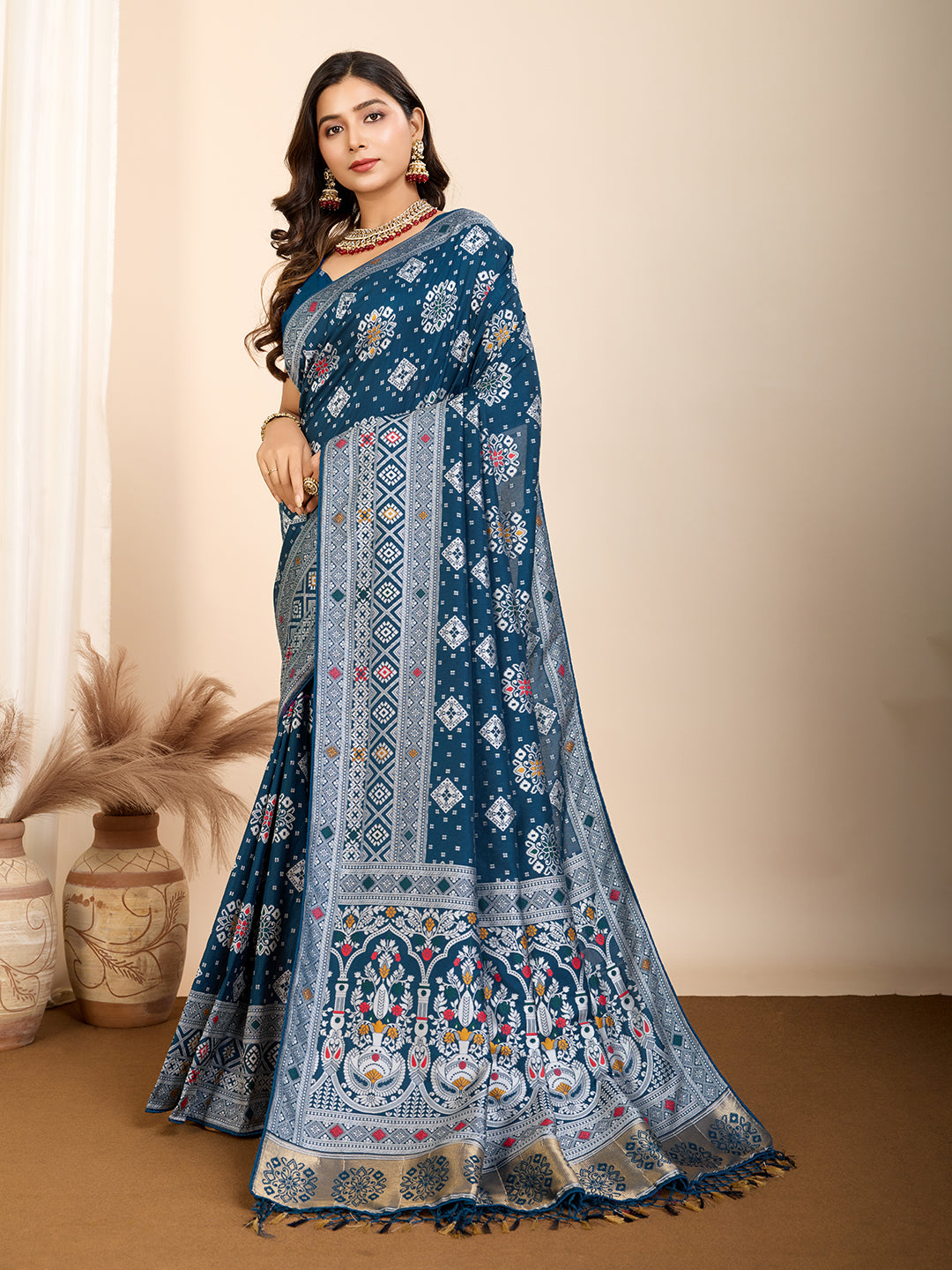 Elegant pure blue silk saree with intricate Mina Kari weaving and a grand rich pallu poojas, and cultural festivities.