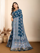 Elegant pure blue silk saree with intricate Mina Kari weaving and a grand rich pallu poojas, and cultural festivities.