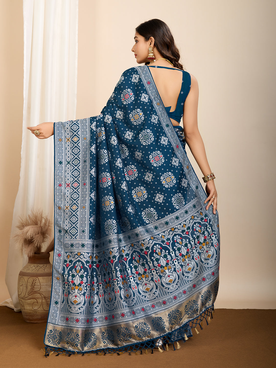 Elegant pure blue silk saree with intricate Mina Kari weaving and a grand rich pallu poojas, and cultural festivities.