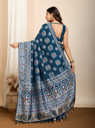 Elegant pure blue silk saree with intricate Mina Kari weaving and a grand rich pallu poojas, and cultural festivities.