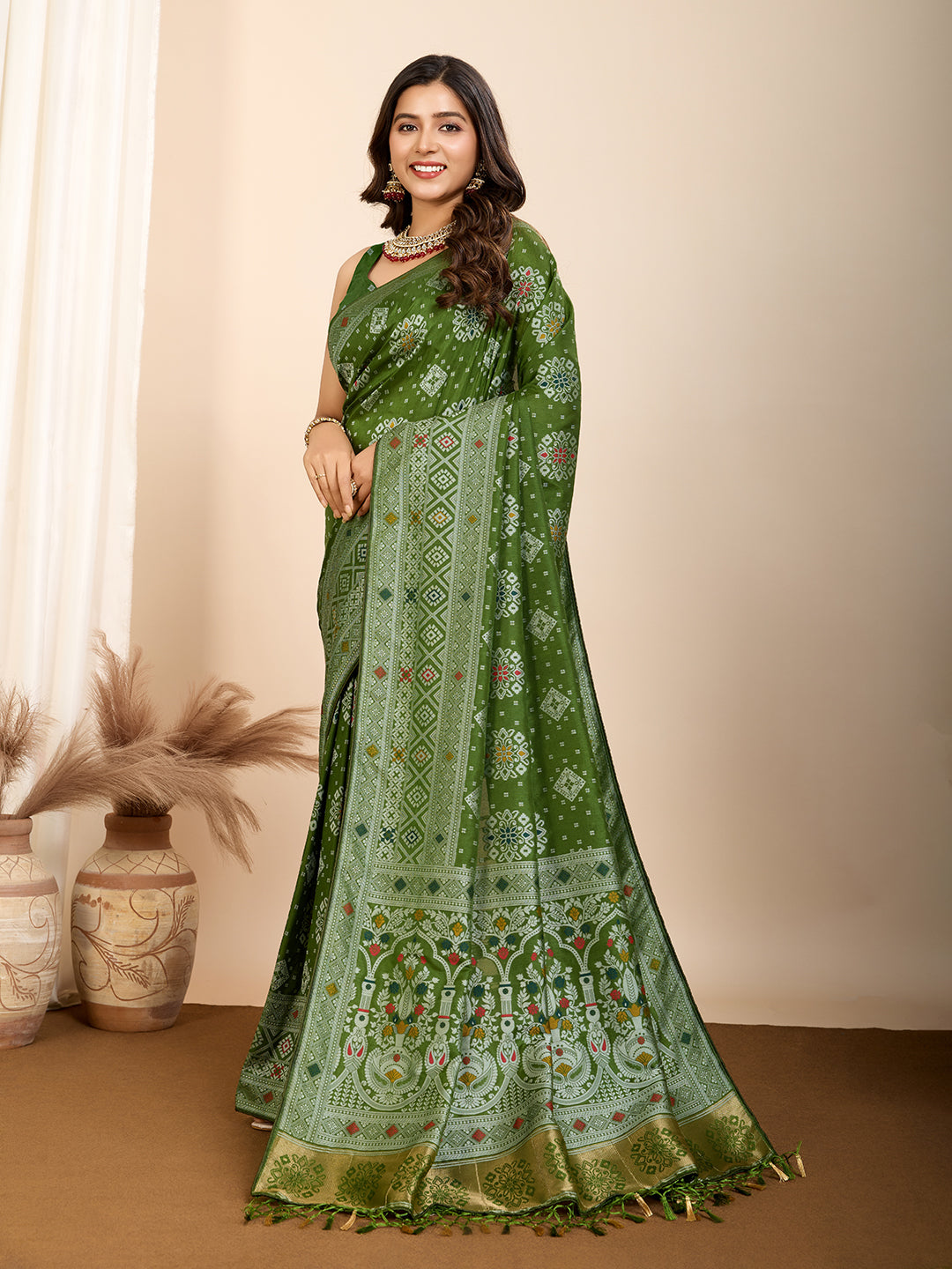 Graceful pure green silk saree with all over Mina Kari weaving and rich zari pallu.