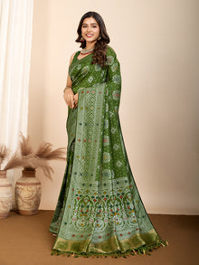 Graceful pure green silk saree with all over Mina Kari weaving and rich zari pallu.