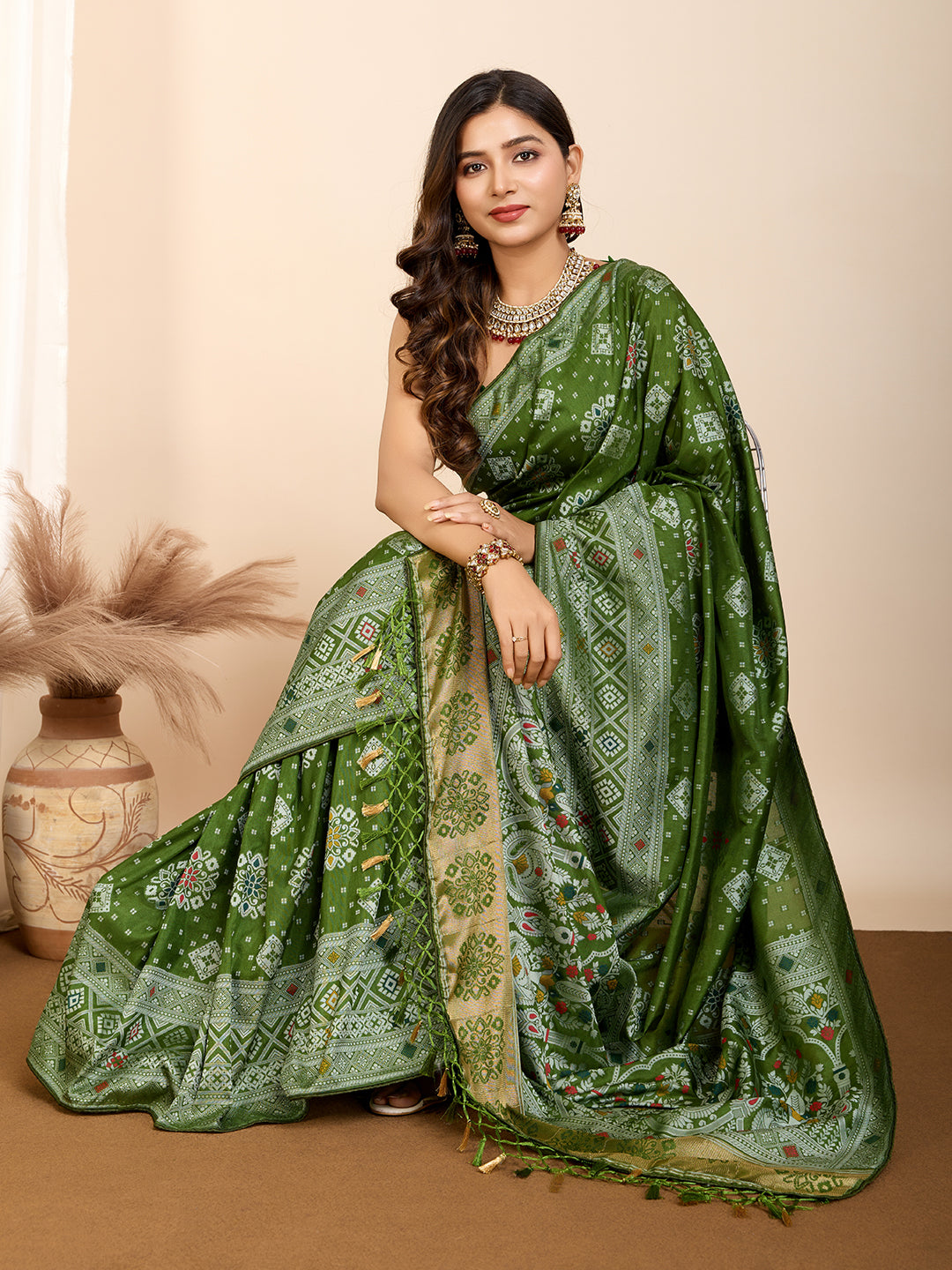 Graceful pure green silk saree with all over Mina Kari weaving and rich zari pallu.
