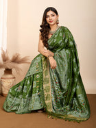 Graceful pure green silk saree with all over Mina Kari weaving and rich zari pallu.
