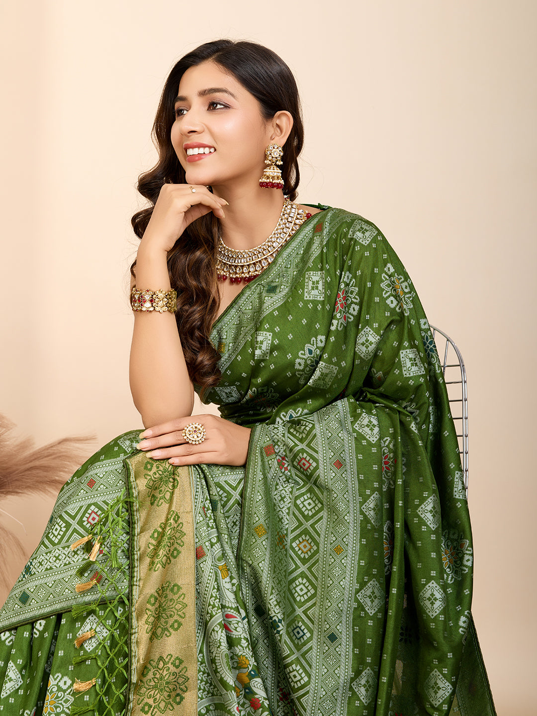 Graceful pure green silk saree with all over Mina Kari weaving and rich zari pallu.