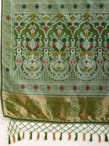 Graceful pure green silk saree with all over Mina Kari weaving and rich zari pallu.