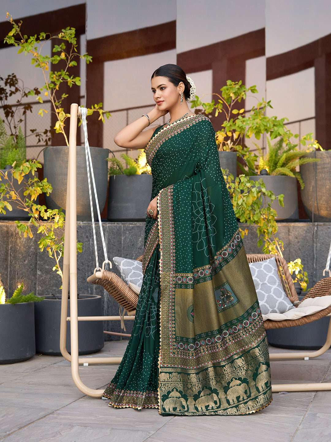 Green cotton saree with all-over table print and foil or lace border. Comes with a contrast blouse Perfect for festive