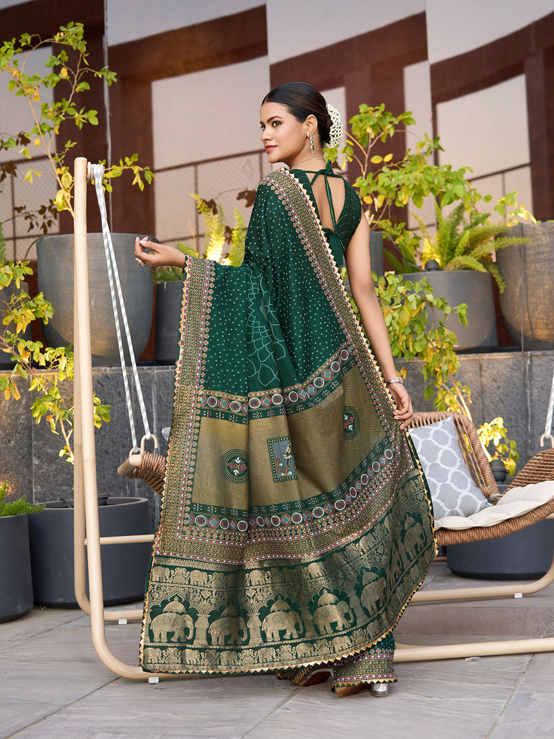 Green cotton saree with all-over table print and foil or lace border. Comes with a contrast blouse Perfect for festive