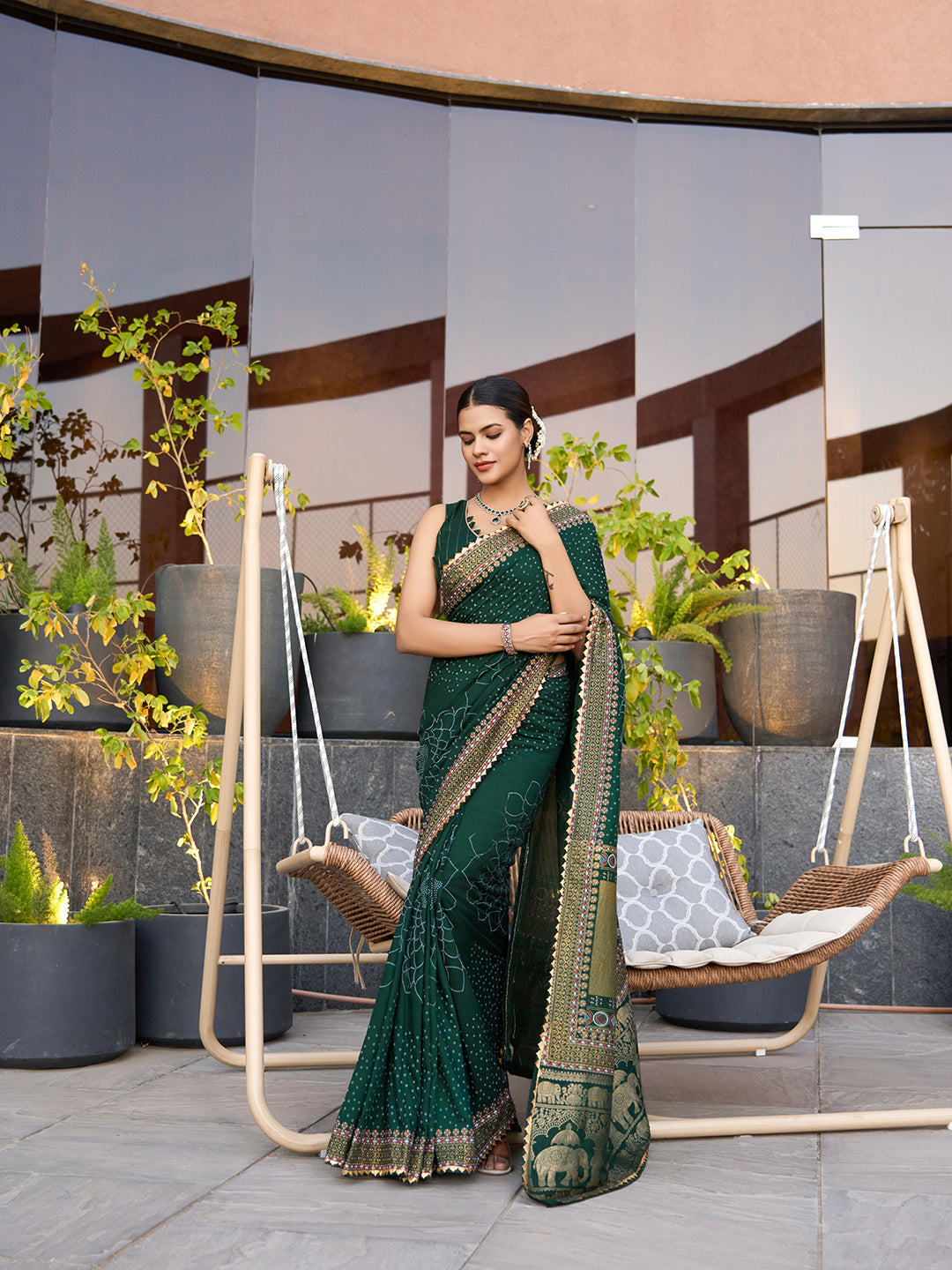 Green cotton saree with all-over table print and foil or lace border. Comes with a contrast blouse Perfect for festive