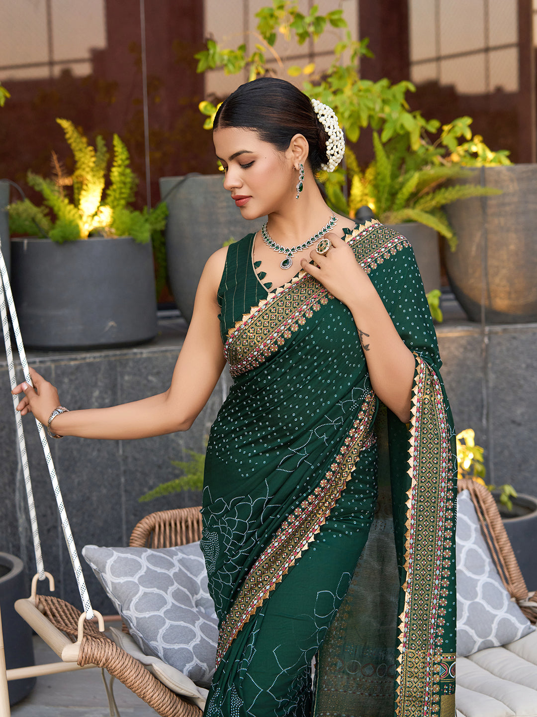 Green cotton saree with all-over table print and foil or lace border. Comes with a contrast blouse Perfect for festive