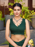 Green cotton saree with all-over table print and foil or lace border. Comes with a contrast blouse Perfect for festive