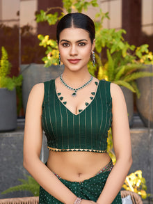 Green cotton saree with all-over table print and foil or lace border. Comes with a contrast blouse Perfect for festive