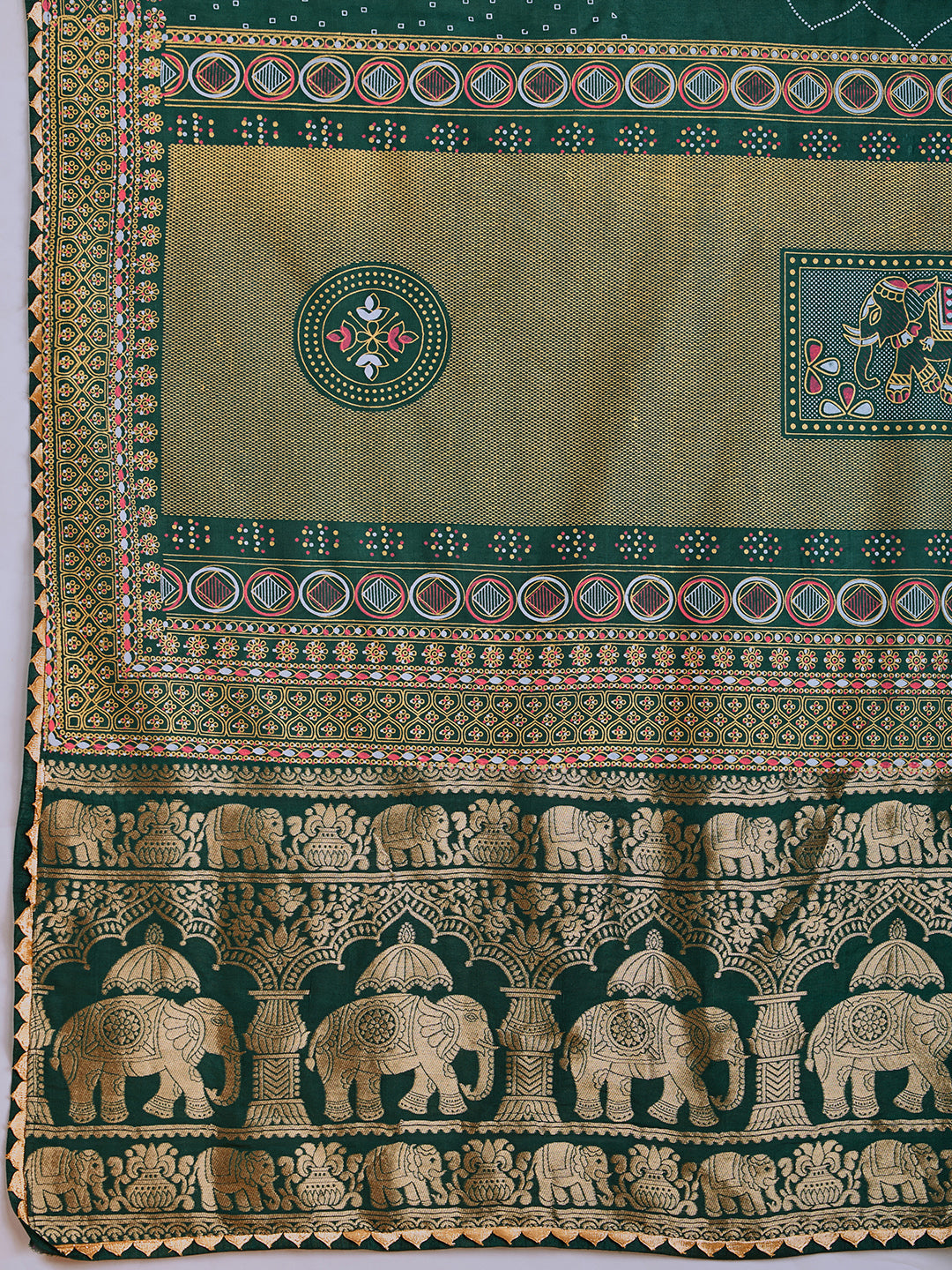 Green cotton saree with all-over table print and foil or lace border. Comes with a contrast blouse Perfect for festive