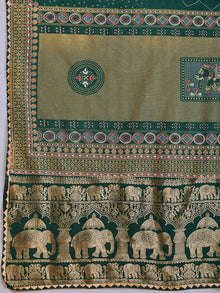 Green cotton saree with all-over table print and foil or lace border. Comes with a contrast blouse Perfect for festive