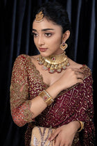 Maroon designer saree with heavy golden sequin embroidery for weddings and festive wear