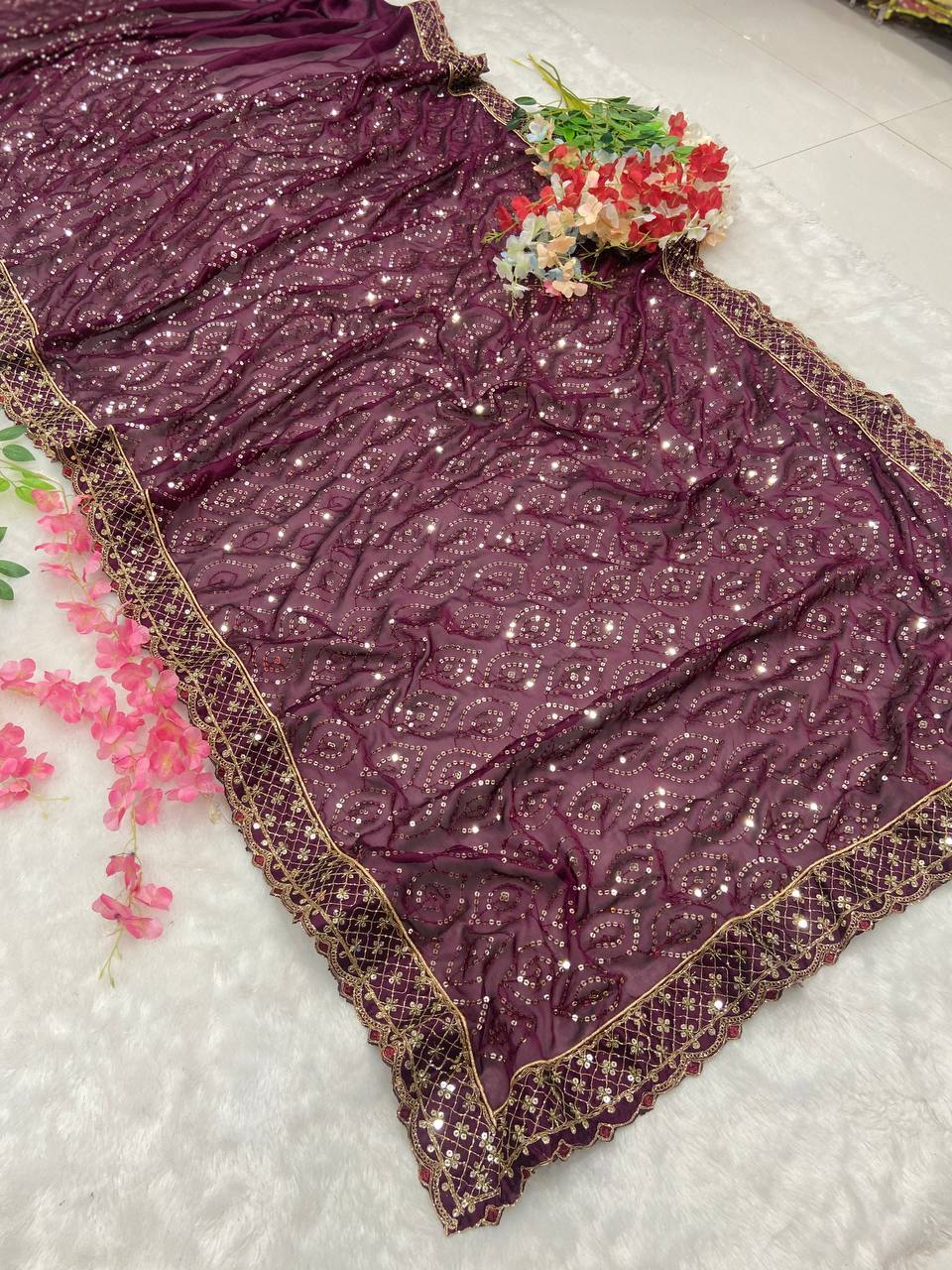 Maroon designer saree with heavy golden sequin embroidery for weddings and festive wear