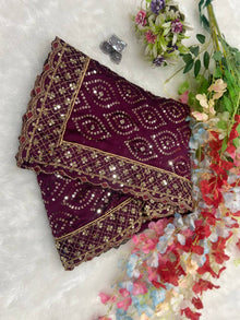 Maroon designer saree with heavy golden sequin embroidery for weddings and festive wear